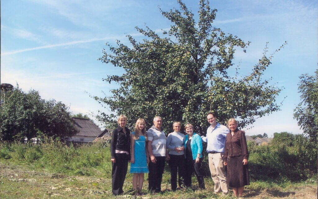 Esther Safran Foer, center right, and her son Frank, to her right, in Ukraine with descendants of the family that hid her father during the war. (Courtesy)