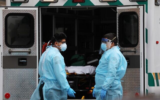 Medics wear protective gear as they arrive at a Brooklyn hospital to pick up a patient on April 18, 2020 in the Brooklyn borough of New York City. (Spencer Platt/Getty Images/AFP) Medics wear protective gear as they arrive at a Brooklyn hospital to pick up a patient on April 18, 2020 in the Brooklyn borough of New York City. (Spencer Platt/Getty Images/AFP)