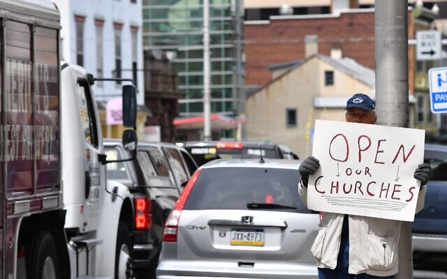 Illustrative: A man takes part in a demonstration against closure of houses of worship on April 20, 2020 in Harrisburg, Pennsylvania. (Photo by Nicholas Kamm / AFP) Illustrative: A man takes part in a demonstration against closure of houses of worship on April 20, 2020 in Harrisburg, Pennsylvania. (Photo by Nicholas Kamm / AFP)