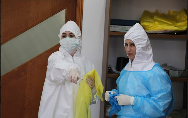 Palestinian health professionals standing in a quarantine facility in the northern West Bank city of Tulkarem on April 3, 2020. (Credit: Wafa) Palestinian health professionals standing in a quarantine facility in the northern West Bank city of Tulkarem on April 3, 2020. (Credit: Wafa)