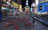 In this March 16, 2020 file photo, a woman walks through an almost empty Times Square in New York, March 16, 2020. (AP Photo/Seth Wenig)