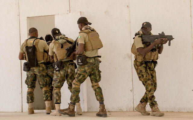In this February 18, 2020, file photo, Nigerian Navy Special Boat Service troops exercise under the supervision of British special forces during US military-led annual counterterrorism exercise in Thies, Senegal. (AP Photo/Cheikh A.T. Sy, File) In this February 18, 2020, file photo, Nigerian Navy Special Boat Service troops exercise under the supervision of British special forces during US military-led annual counterterrorism exercise in Thies, Senegal. (AP Photo/Cheikh A.T. Sy, File)