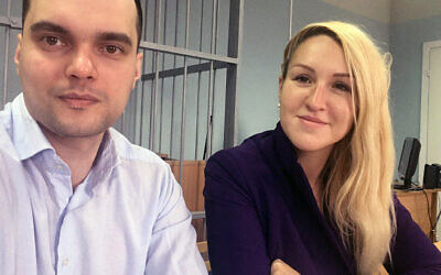 In this handout photo released by the Foundation for Fighting Corruption, Dr. Anastasia Vasilyeva of the Alliance of Doctors union, right, and the Foundation for Fighting Corruption's lawyer Vyacheslav Gimadi sit in court room in Okulovo, Novgorod region, about 400 kilometers (about 250 miles) northwest of Moscow, Russia, Friday, April 3, 2020. (The Foundation for Fighting Corruption via AP)