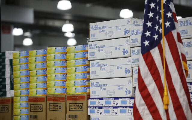 In this March 24, 2020, file photo stacks of medical supplies are housed at the Jacob Javits Center that will become a temporary hospital in response to the COVID-19 outbreak in New York. A review of federal purchasing contracts by The Associated Press shows federal agencies waited until mid-March to begin placing bulk orders of N95 respirator masks, mechanical ventilators and other equipment needed by front-line health care workers. (AP Photo/John Minchillo, File) In this March 24, 2020, file photo stacks of medical supplies are housed at the Jacob Javits Center that will become a temporary hospital in response to the COVID-19 outbreak in New York. A review of federal purchasing contracts by The Associated Press shows federal agencies waited until mid-March to begin placing bulk orders of N95 respirator masks, mechanical ventilators and other equipment needed by front-line health care workers. (AP Photo/John Minchillo, File)