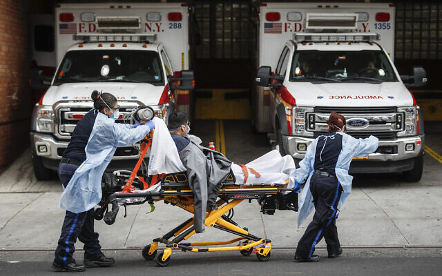 Patients are brought into Wyckoff Heights Medical Center by staff wearing personal protective gear due to COVID-19 concerns on April 7, 2020, in the Brooklyn borough of New York. (AP/John Minchillo) Patients are brought into Wyckoff Heights Medical Center by staff wearing personal protective gear due to COVID-19 concerns on April 7, 2020, in the Brooklyn borough of New York. (AP/John Minchillo)