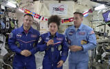 In this image from video made available by NASA, US astronaut Jessica Meir speaks, accompanied by Andrew Morgan and Chris Cassidy, during a news conference held by the American members of the International Space Station on Friday, April 10, 2020.(NASA via AP)