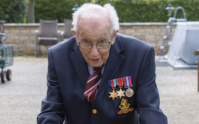 Tom Moore, a 99-year-old British veteran who has started a campaign to thank the National Health Service by walking lengths in his garden.(Moore Family via AP) Tom Moore, a 99-year-old British veteran who has started a campaign to thank the National Health Service by walking lengths in his garden.(Moore Family via AP)