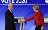 Democratic presidential candidates former Vice President Joe Biden, left, and Sen. Elizabeth Warren, Democrat-Massachusetts, shake hands on stage before the start of a Democratic presidential primary debate hosted by ABC News, Apple News, and WMUR-TV at Saint Anselm College in Manchester, New Hampshire, February 7, 2020. (Charles Krupa/AP)