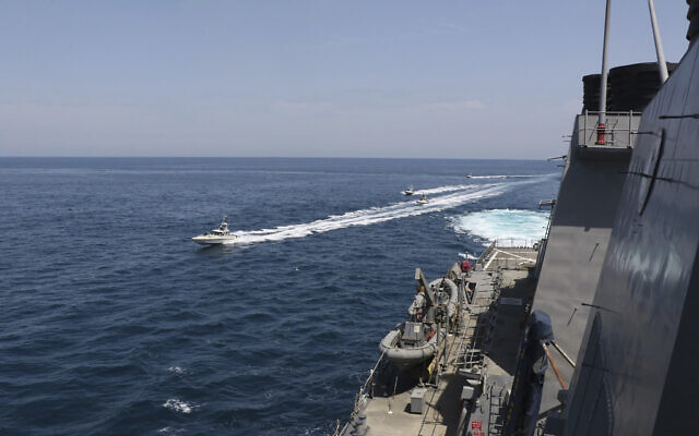 Iranian Revolutionary Guard vessels sail close to US military ships in the Persian Gulf near Kuwait, April 15, 2020. (US Navy via AP) Iranian Revolutionary Guard vessels sail close to US military ships in the Persian Gulf near Kuwait, April 15, 2020. (US Navy via AP)