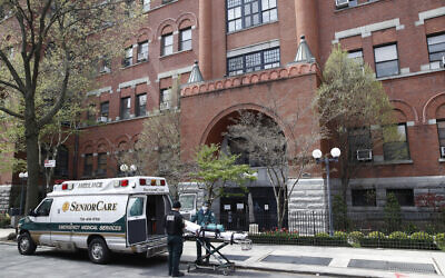 Emergency medical workers arrive at Cobble Hill Health Center, in Brooklyn, NY, April 17, 2020. (John Minchillo/AP)