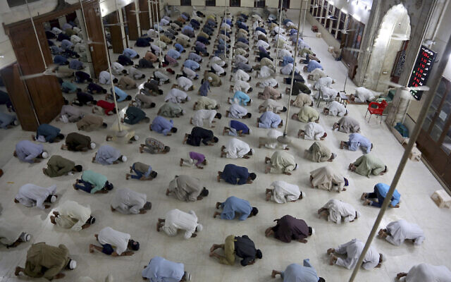 In this April 19, 2020, file photo, people attend evening prayers while maintaining a level of social distancing to help avoid the spread of the coronavirus, at a mosque in Karachi, Pakistan. (AP Photo/Fareed Khan, File) In this April 19, 2020, file photo, people attend evening prayers while maintaining a level of social distancing to help avoid the spread of the coronavirus, at a mosque in Karachi, Pakistan. (AP Photo/Fareed Khan, File)