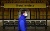 A man wearing a face mask in Munich, Germany, April 21, 2020. (AP Photo/Matthias Schrader)