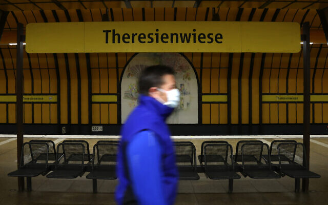 A man wearing a face mask in Munich, Germany, April 21, 2020. (AP Photo/Matthias Schrader) A man wearing a face mask in Munich, Germany, April 21, 2020. (AP Photo/Matthias Schrader)