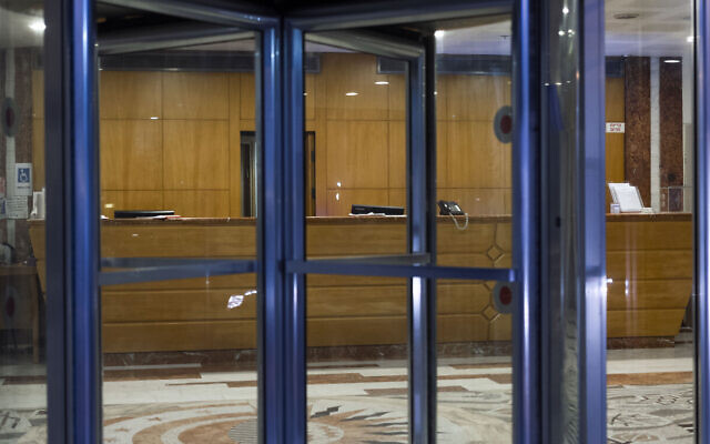 In this April 4, 2020, photo, a closed hotel is seen during lockdown following government measures to help stop the spread of the coronavirus in Tel Aviv, Israel. (AP Photo/Oded Balilty)