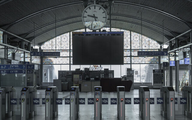 In this April 6, 2020, photo, a train station is deserted after authorities shut down railway service in an effort to contain the spread of the coronavirus, in Tel Aviv, Israel. (AP Photo/Oded Balilty)