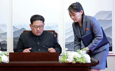 North Korean leader Kim Jong Un signs a guestbook next to his sister Kim Yo Jong, right, inside the Peace House at the border village of Panmunjom in Demilitarized Zone, April 27, 2018. (Korea Summit Press Pool via AP, File)