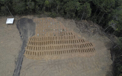 Freshly dug graves are seen at the Nossa Senhora Aparecida cemetery, amid the new coronavirus pandemic in Manaus, Amazonas state, Brazil, Wednesday, April 22, 2020. (AP/Emerson Cardoso)