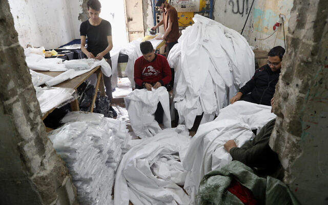 In this Monday, March 30, 2020 file photo, Palestinians make protective overalls meant to shield people from the coronavirus, to be exported to Israel, at a local factory in Gaza City (AP Photo/Adel Hana, File) In this Monday, March 30, 2020 file photo, Palestinians make protective overalls meant to shield people from the coronavirus, to be exported to Israel, at a local factory in Gaza City (AP Photo/Adel Hana, File)