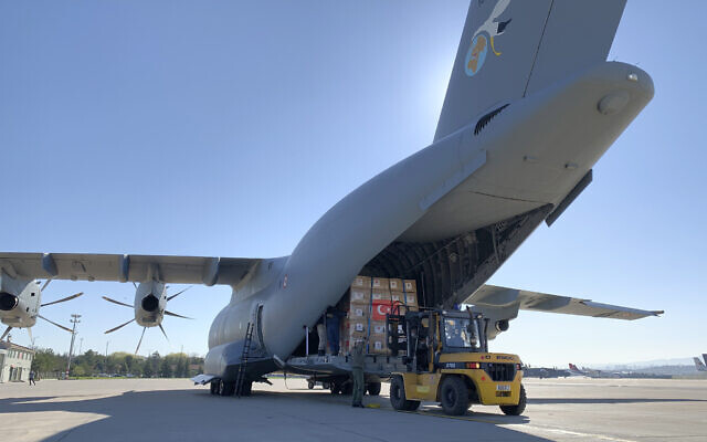 In this handout photo provided by the Turkish Defense Ministry, Turkish soldiers prepare to load a military cargo plane with Personal Protection Equipment donated by Turkey to help United States combat the new coronavirus outbreak, at the Etimesgut airport outside Ankara, Turkey, Tuesday, April 28, 2020. Turkey is sending a planeload of surgical masks, N95 masks and hazmat suits to U.S. to help the country battle the coronavirus outbreak.(Turkish Defence Ministry via AP) In this handout photo provided by the Turkish Defense Ministry, Turkish soldiers prepare to load a military cargo plane with Personal Protection Equipment donated by Turkey to help United States combat the new coronavirus outbreak, at the Etimesgut airport outside Ankara, Turkey, Tuesday, April 28, 2020. Turkey is sending a planeload of surgical masks, N95 masks and hazmat suits to U.S. to help the country battle the coronavirus outbreak.(Turkish Defence Ministry via AP)