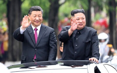In this photo from June 20, 2019, released by China's Xinhua News Agency, visiting Chinese President Xi Jinping, left, and North Korean leader Kim Jong Un wave from an open top limousine as they travel along a street in Pyongyang, North Korea. (Ju Peng/Xinhua via AP) In this photo from June 20, 2019, released by China's Xinhua News Agency, visiting Chinese President Xi Jinping, left, and North Korean leader Kim Jong Un wave from an open top limousine as they travel along a street in Pyongyang, North Korea. (Ju Peng/Xinhua via AP)