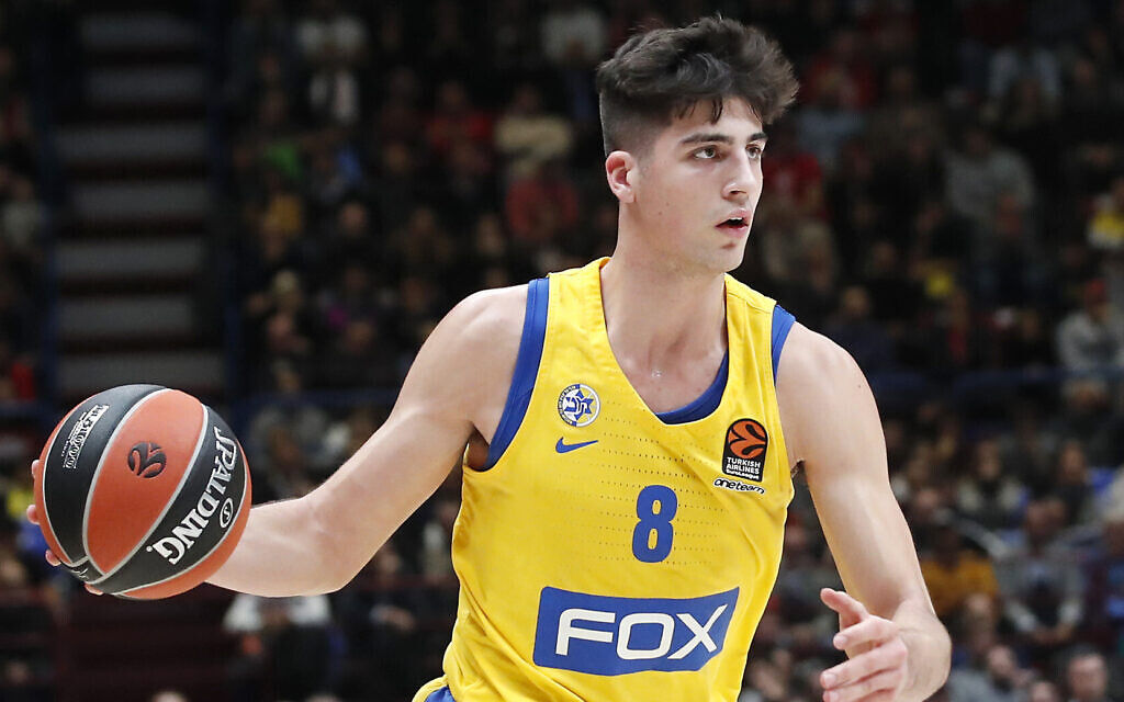 Maccabi Tel Aviv's Deni Avdija controls the ball during the Euro League basketball match between Olimpia Milan and Maccabi Fox Tel Aviv, in Milan, Italy, November 19, 2019. (AP Photo/Antonio Calanni)