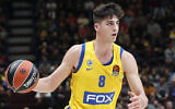 Maccabi Tel Aviv's Deni Avdija controls the ball during the Euro League basketball match between Olimpia Milan and Maccabi Fox Tel Aviv, in Milan, Italy, November 19, 2019. (AP Photo/Antonio Calanni)