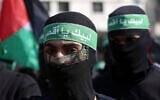 Masked Hamas gunmen march during a protest against the Mideast plan announced by US President Donald Trump,  February 21, 2020.  (AP Photo/Adel Hana)