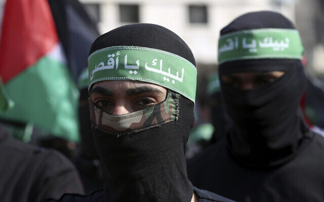 Masked Hamas gunmen march during a protest against the Mideast plan announced by US President Donald Trump, February 21, 2020. (AP Photo/Adel Hana) Masked Hamas gunmen march during a protest against the Mideast plan announced by US President Donald Trump, February 21, 2020. (AP Photo/Adel Hana)