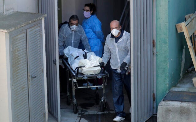 Funeral home workers carry a body from the Vitalia nursing home in Leganes, Spain, April 3, 2020. (AP Photo/Manu Fernandez) Funeral home workers carry a body from the Vitalia nursing home in Leganes, Spain, April 3, 2020. (AP Photo/Manu Fernandez)