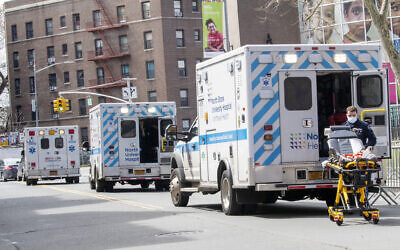 Ambulances line the street outside Elmhurst Hospital Center, in the Queens borough of New York, April 4, 2020. (Mary Altaffer/AP)