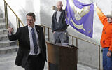 In this Feb. 15, 2019 file photo, Washington state Rep. Matt Shea, R-Spokane Valley, gestures as he gives a speech in front of the liberty state flag at the Capitol in Olympia, Washington, during a rally held by people advocating splitting Washington state into two separate states and questioning the legality of Washington's I-1639 gun-control measure (AP Photo/Ted S. Warren, File)