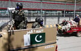 Pakistani soldiers patrol during a government-imposed nationwide lockdown to help contain the spread of coronavirus, in Peshawar, Pakistan, Thursday, April 9, 2020. (AP/Muhammad Sajjad)