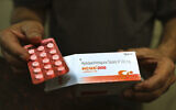 A chemist displays hydroxychloroquine tablets in New Delhi, India, April 9, 2020. AP Photo/Manish Swarup)