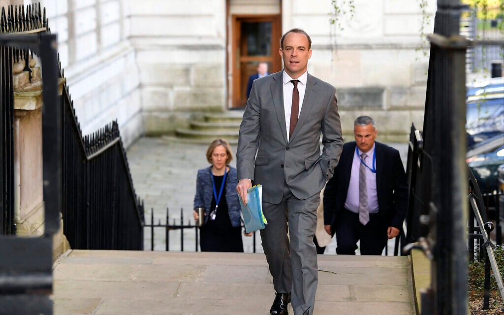 British Foreign Secretary Dominic Raab arrives at Downing Street, London, April 14, 2020 as he stands in for Prime Minister Boris Johnson who is convalescence following his hospitalization with the coronavirus. (Stefan Rousseau / PA via AP) British Foreign Secretary Dominic Raab arrives at Downing Street, London, April 14, 2020 as he stands in for Prime Minister Boris Johnson who is convalescence following his hospitalization with the coronavirus. (Stefan Rousseau / PA via AP)
