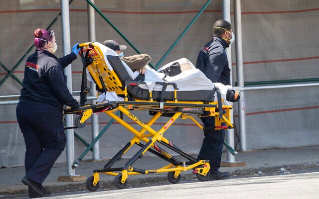 Medics transport a patient to the King David Center for Nursing and Rehabilitation in the Gravesend neighborhood of the Brooklyn borough of New York, Wednesday, April 15, 2020. (AP Photo/Mary Altaffer) Medics transport a patient to the King David Center for Nursing and Rehabilitation in the Gravesend neighborhood of the Brooklyn borough of New York, Wednesday, April 15, 2020. (AP Photo/Mary Altaffer)