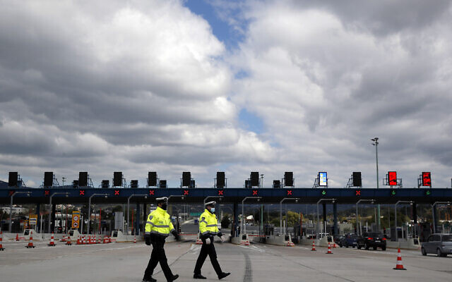 Policemen patrol in Athens, on April 16, 2020. (AP Photo/Thanassis Stavrakis)
