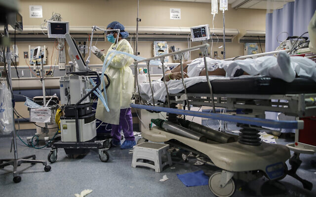 A respiratory specialist operates a ventilator for a patient with COVID-19 who went into cardiac arrest and was revived by staff, April 20, 2020, at St. Joseph's Hospital in Yonkers, New York (AP/John Minchillo) A respiratory specialist operates a ventilator for a patient with COVID-19 who went into cardiac arrest and was revived by staff, April 20, 2020, at St. Joseph's Hospital in Yonkers, New York (AP/John Minchillo)