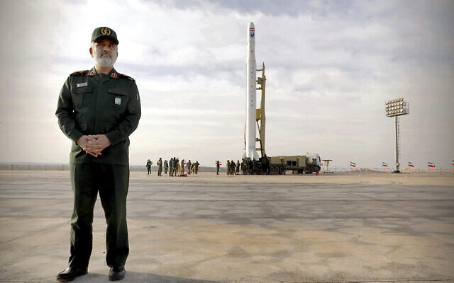 In this photo released April 22, 2020, by Sepahnews, Gen. Amir Ali Hajizadeh, the head of the Revolutionary Guard's aerospace division, stands in front of an Iranian rocket carrying a satellite in an undisclosed site believed to be in Iran's Semnan province. (Sepahnews via AP) In this photo released April 22, 2020, by Sepahnews, Gen. Amir Ali Hajizadeh, the head of the Revolutionary Guard's aerospace division, stands in front of an Iranian rocket carrying a satellite in an undisclosed site believed to be in Iran's Semnan province. (Sepahnews via AP)
