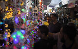 Palestinians shop in the Zawiya market ahead of the Muslim holy month of Ramadan, in Gaza City, April 22, 2020. (AP/Khalil Hamra)