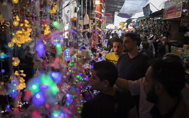 Palestinians shop in the Zawiya market ahead of the Muslim holy month of Ramadan, in Gaza City, April 22, 2020. (AP/Khalil Hamra) Palestinians shop in the Zawiya market ahead of the Muslim holy month of Ramadan, in Gaza City, April 22, 2020. (AP/Khalil Hamra)
