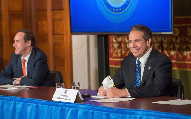 New York Governor Andrew Cuomo addresses the media while holding an N95 mask during his daily press briefing on COVID-19, at the state capitol in Albany, New York, April 24, 2020. (Darren McGee/Office of Governor Andrew M. Cuomo via AP) New York Governor Andrew Cuomo addresses the media while holding an N95 mask during his daily press briefing on COVID-19, at the state capitol in Albany, New York, April 24, 2020. (Darren McGee/Office of Governor Andrew M. Cuomo via AP)