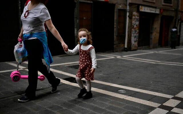 Irati, a little girl, 3 years old, wears face mask to prevent the coronavirus while she's going for a walk with her mother, Montse Fernandez , in Pamplona, northern Spain, Sunday, April 27, 2020. (AP Photo/Alvaro Barrientos) Irati, a little girl, 3 years old, wears face mask to prevent the coronavirus while she's going for a walk with her mother, Montse Fernandez , in Pamplona, northern Spain, Sunday, April 27, 2020. (AP Photo/Alvaro Barrientos)