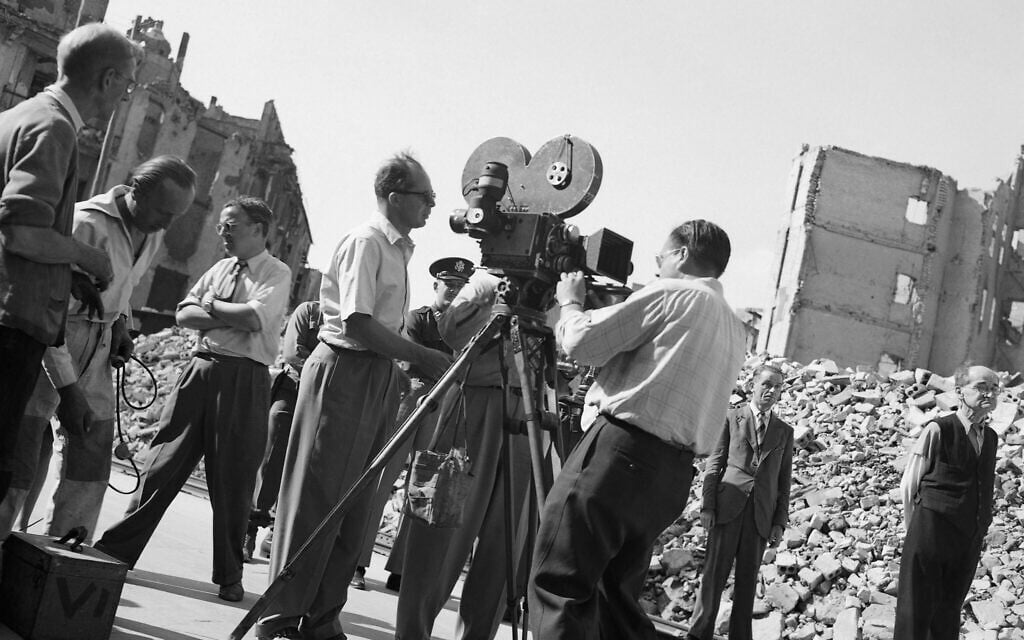 Director of Paramount's 'Foreign Affair' Billy Wilder, left, directs camera crew in shooting background material for the picture in one of Berlin's bombed out streets, August 18, 1947. (AP Photo/Wolfgang Sorsche)