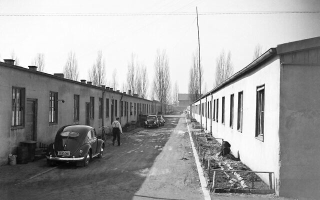 Refugees from former German territories live in the once notorious Dachau camp on March 10, 1954. Cars parked in Barracks Street give testimony of wealth achieved by some refugees. (AP Photo/Heinrich Sanden, Sr.) Refugees from former German territories live in the once notorious Dachau camp on March 10, 1954. Cars parked in Barracks Street give testimony of wealth achieved by some refugees. (AP Photo/Heinrich Sanden, Sr.)
