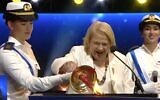 Screen capture of Renee Abitbul, 92, lighting a torch during the annual torch-lighting ceremony at the start of Independence Day, April 28, 2020. (Twitter)