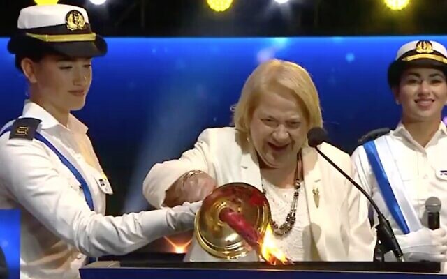 Screen capture of Renee Abitbul, 92, lighting a torch during the annual torch-lighting ceremony at the start of Independence Day, April 28, 2020. (Twitter) Screen capture of Renee Abitbul, 92, lighting a torch during the annual torch-lighting ceremony at the start of Independence Day, April 28, 2020. (Twitter)