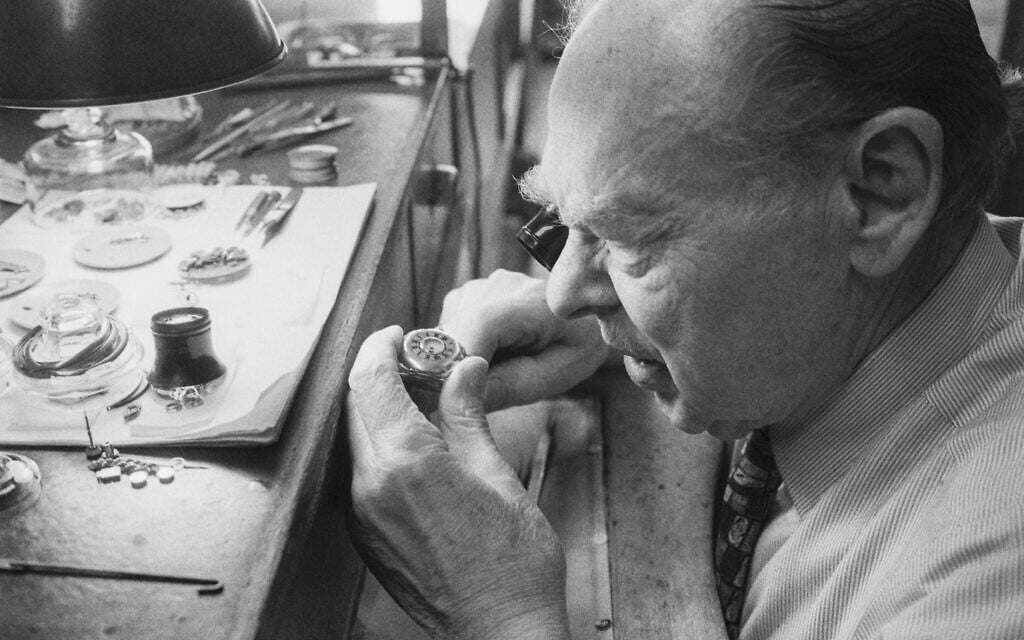 Abraham Perecman repairs a watch at his bench. (Courtesy Adam Frankel)