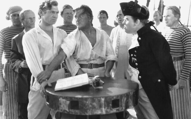 Crew members of the HMS Bounty, including Clark Gable (left) as Fletcher Christian and Charles Laughton (right) as Captain Bligh, in the 1935 film version of Charles Nordhoff and James Norman Hall's Mutiny on the Bounty. (MGM) Crew members of the HMS Bounty, including Clark Gable (left) as Fletcher Christian and Charles Laughton (right) as Captain Bligh, in the 1935 film version of Charles Nordhoff and James Norman Hall's Mutiny on the Bounty. (MGM)