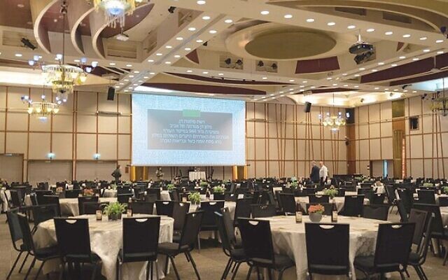A dining hall is set up for a Passover Seder at Tel Aviv's Dan Panorama hotel on April 7, 2020. (Israel Defense Forces) A dining hall is set up for a Passover Seder at Tel Aviv's Dan Panorama hotel on April 7, 2020. (Israel Defense Forces)