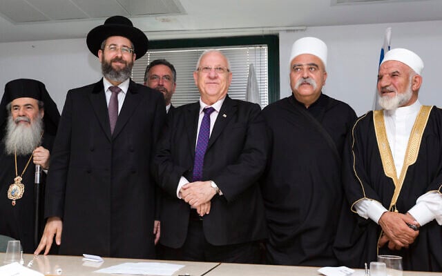 Illustrative: Greek Orthodox patriarch Theophilos III (L), Ashkenazi Chief Rabbi David Lau (2nd-L), then President-elect Reuven Rivlin (C), Druze spiritual leader Sheikh Muafek Tarif (2nd-R), and Union of Imams in Israel leader Sheikh Muhammad Kiwan, during a meeting of religious leaders at the offices of the Chief Rabbinate in Jerusalem, on July 9, 2014. (Flash90) Illustrative: Greek Orthodox patriarch Theophilos III (L), Ashkenazi Chief Rabbi David Lau (2nd-L), then President-elect Reuven Rivlin (C), Druze spiritual leader Sheikh Muafek Tarif (2nd-R), and Union of Imams in Israel leader Sheikh Muhammad Kiwan, during a meeting of religious leaders at the offices of the Chief Rabbinate in Jerusalem, on July 9, 2014. (Flash90)